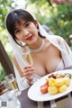 A woman in a wedding dress holding a glass of champagne.